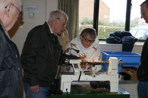 Janet Howard and Keith in there somewhere turning a pen
